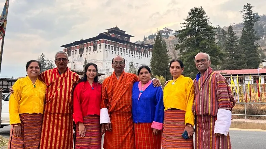 Oyster Holidays group in traditional Bhutanese dress in Bhutan