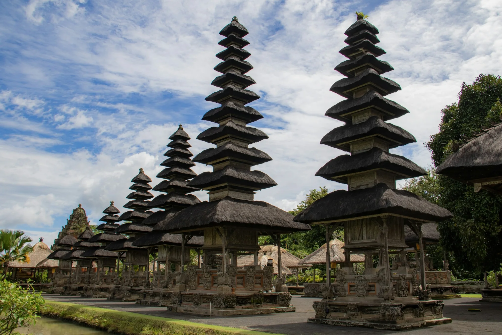 A multi-tiered Balinese meru temple on the water in Bali