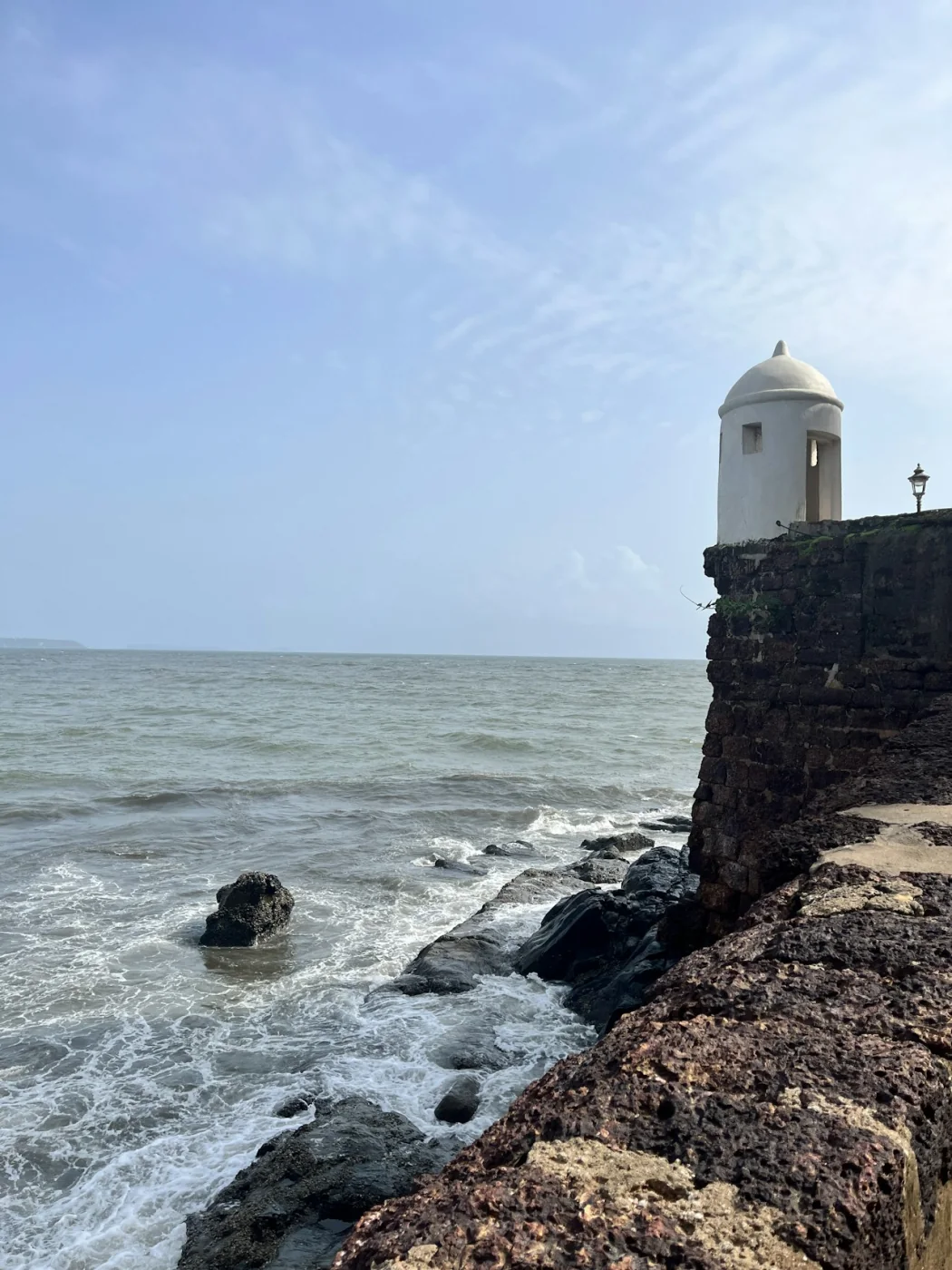 The lighthouse of Fort Aguada on the cliffs above the Goa coast
