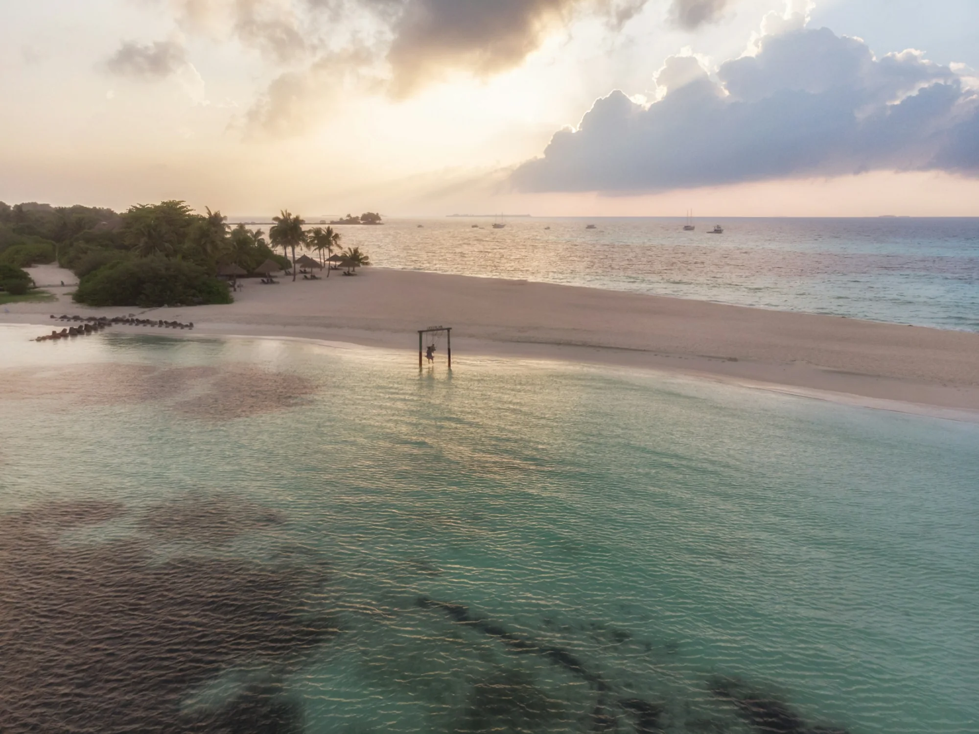 A sandbank fringed by clear ocean in the Maldives