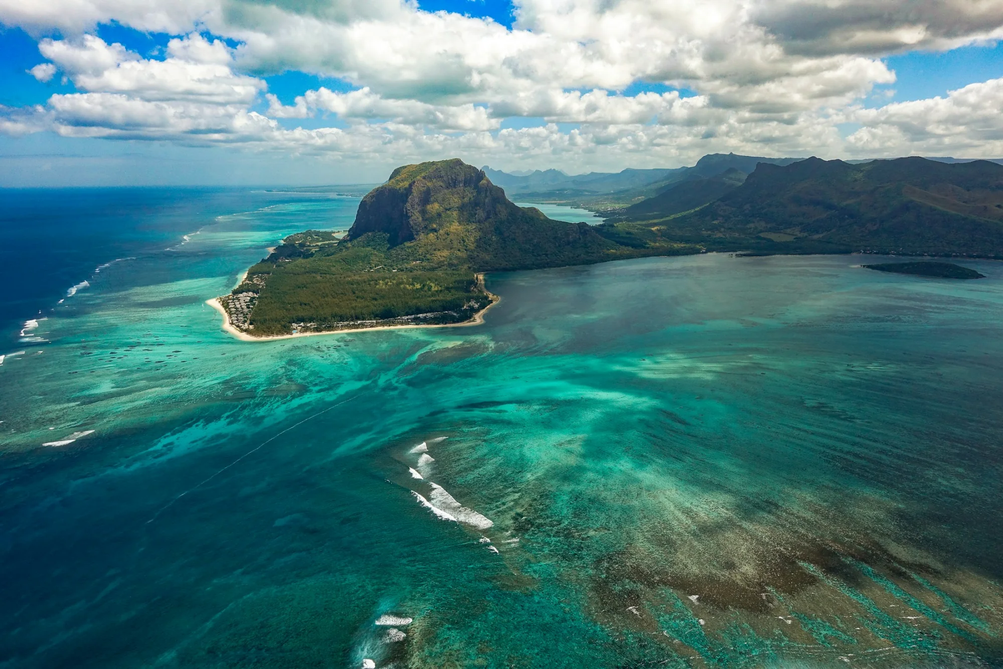 The Le Morne mountain above the turquoise reef of Mauritius
