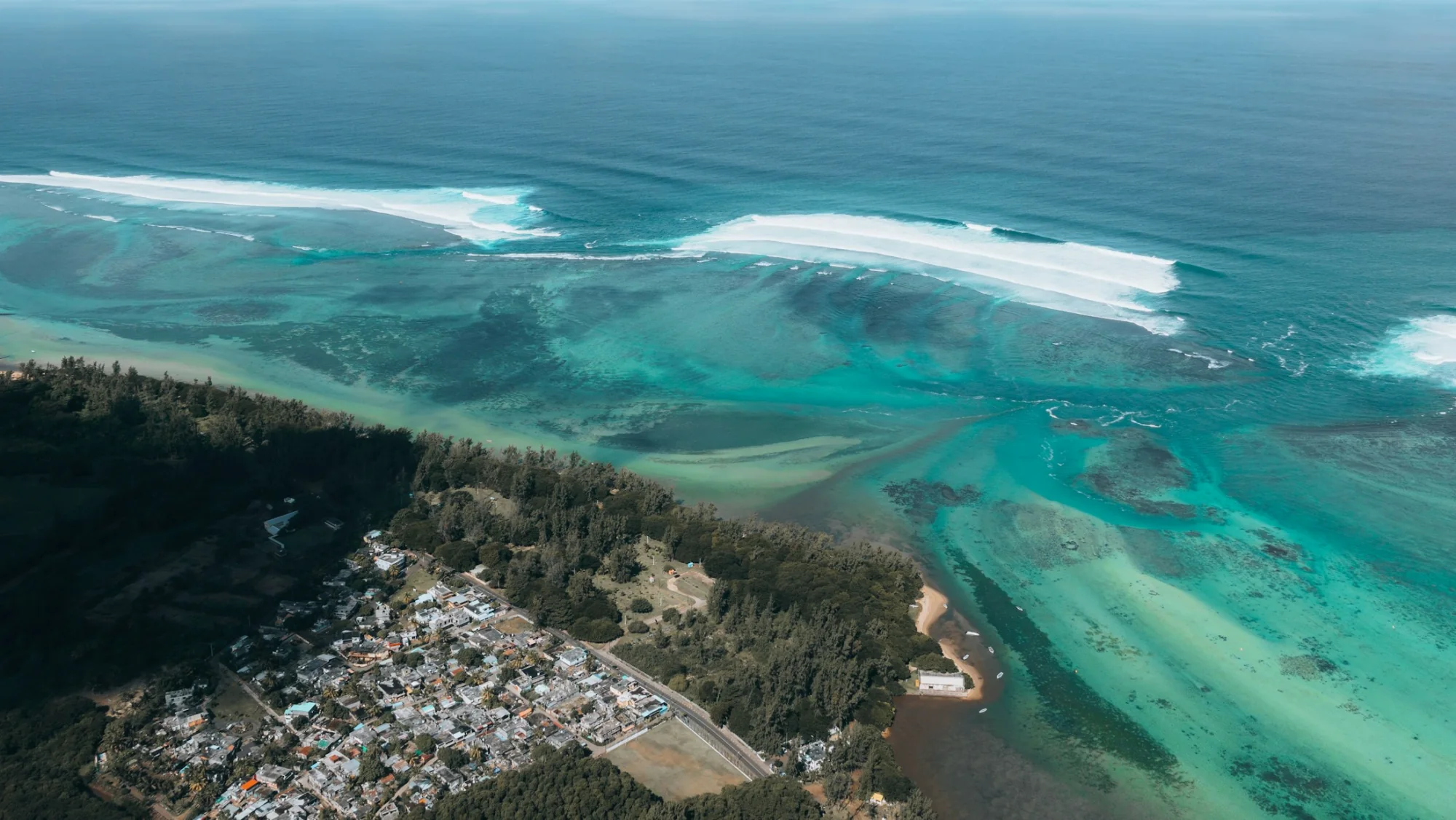 Aerial view of a turquoise lagoon and reef in Mauritius