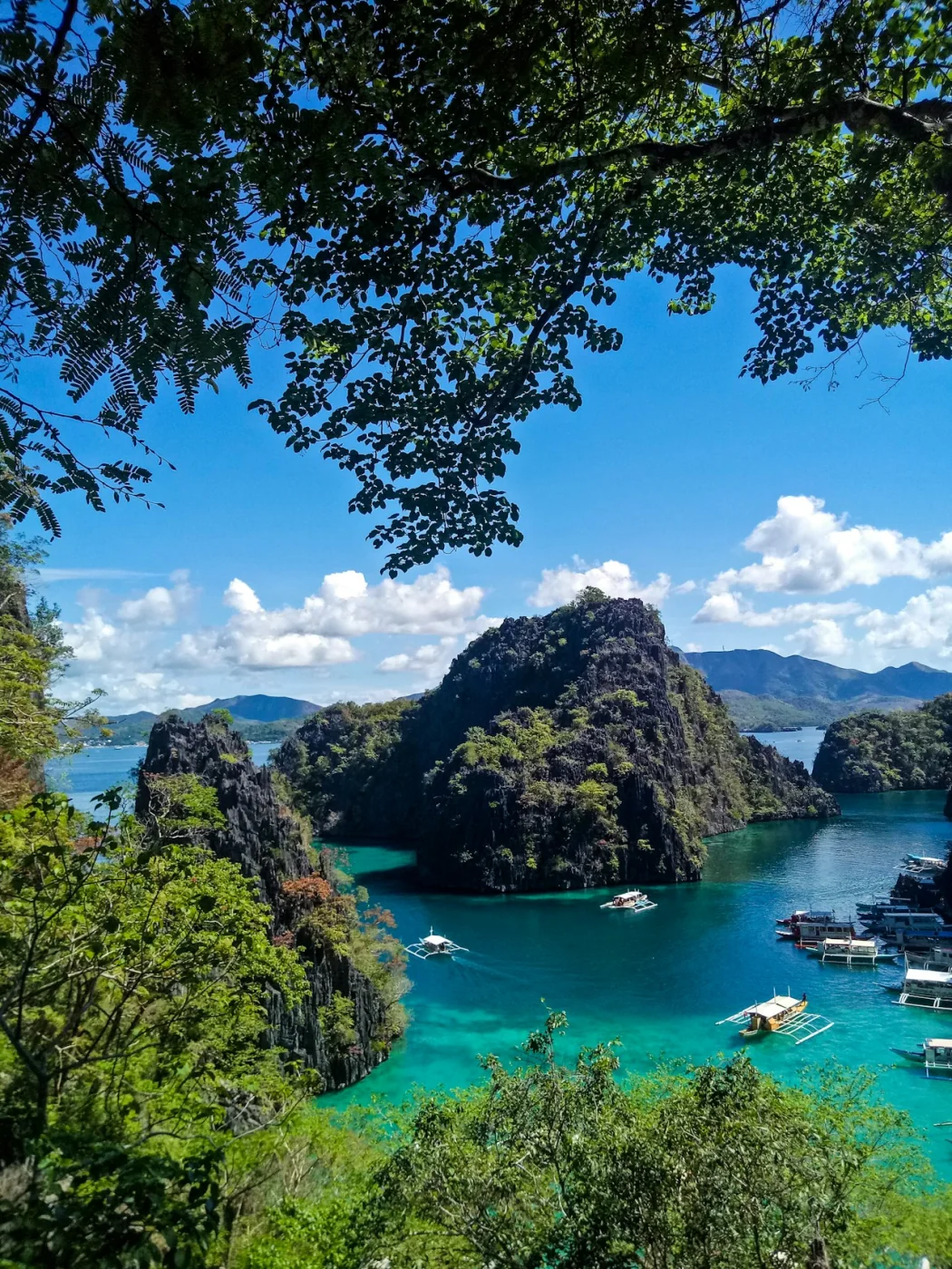 Green limestone cliffs above the water at Coron, Philippines
