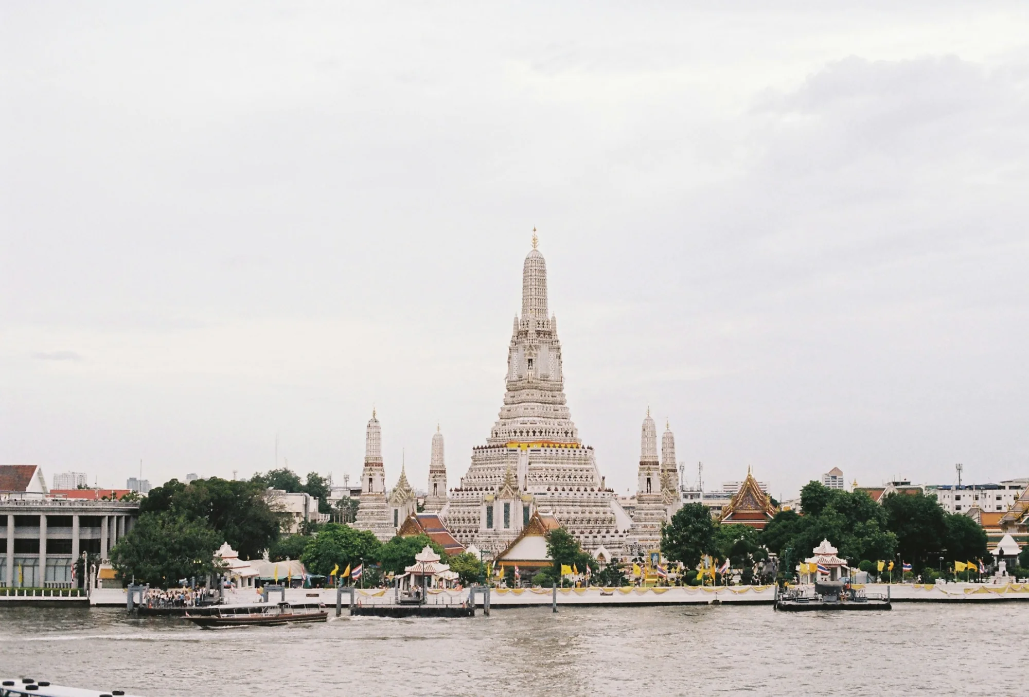 The spired prang of Wat Arun on the Chao Phraya River in Bangkok, Thailand