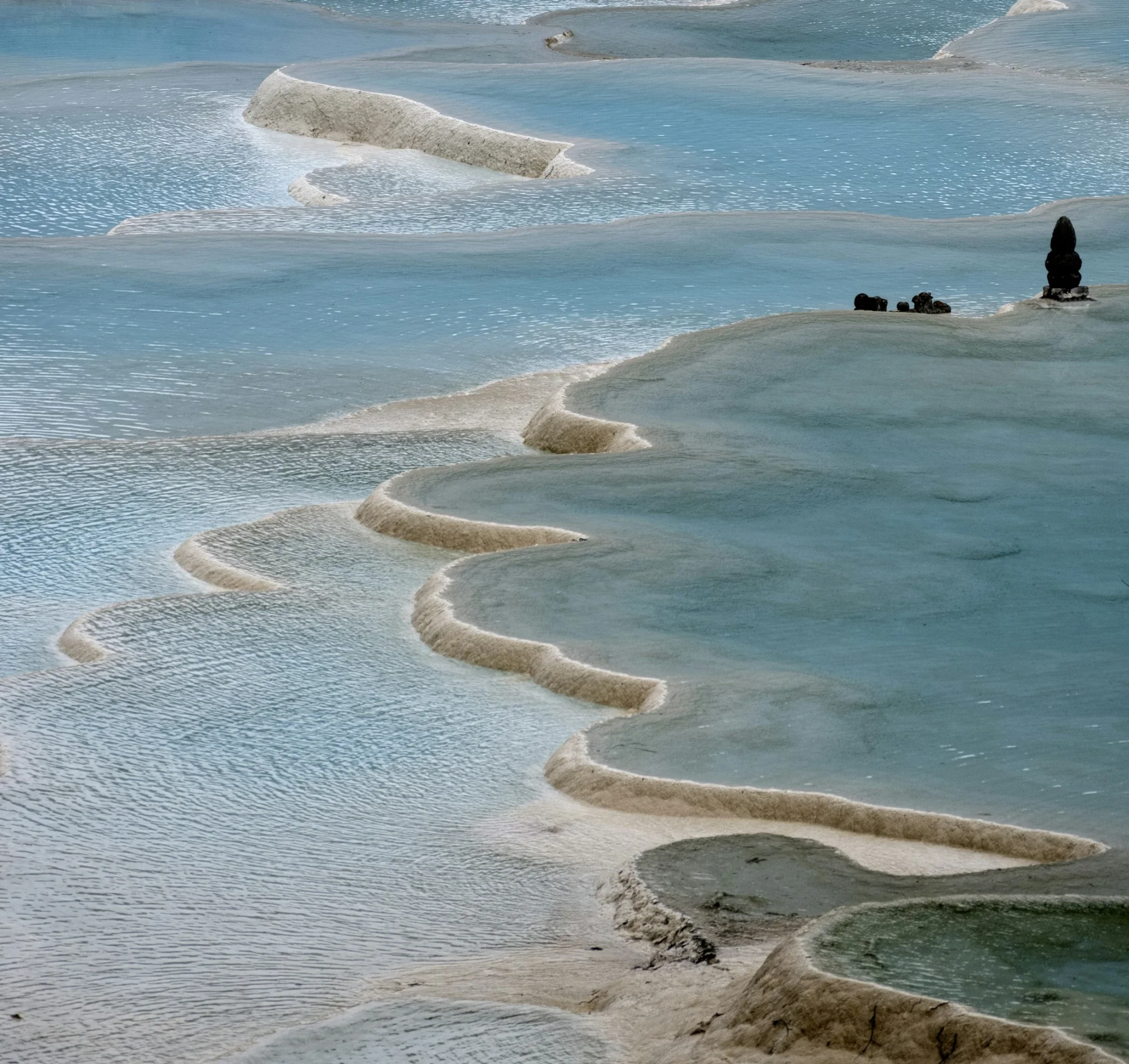 The white travertine terraces and turquoise pools of Pamukkale, Turkey