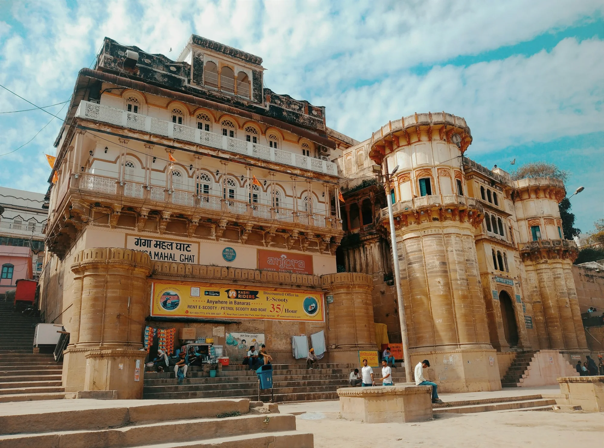 Ornate sandstone riverfront architecture above the ghats of Varanasi