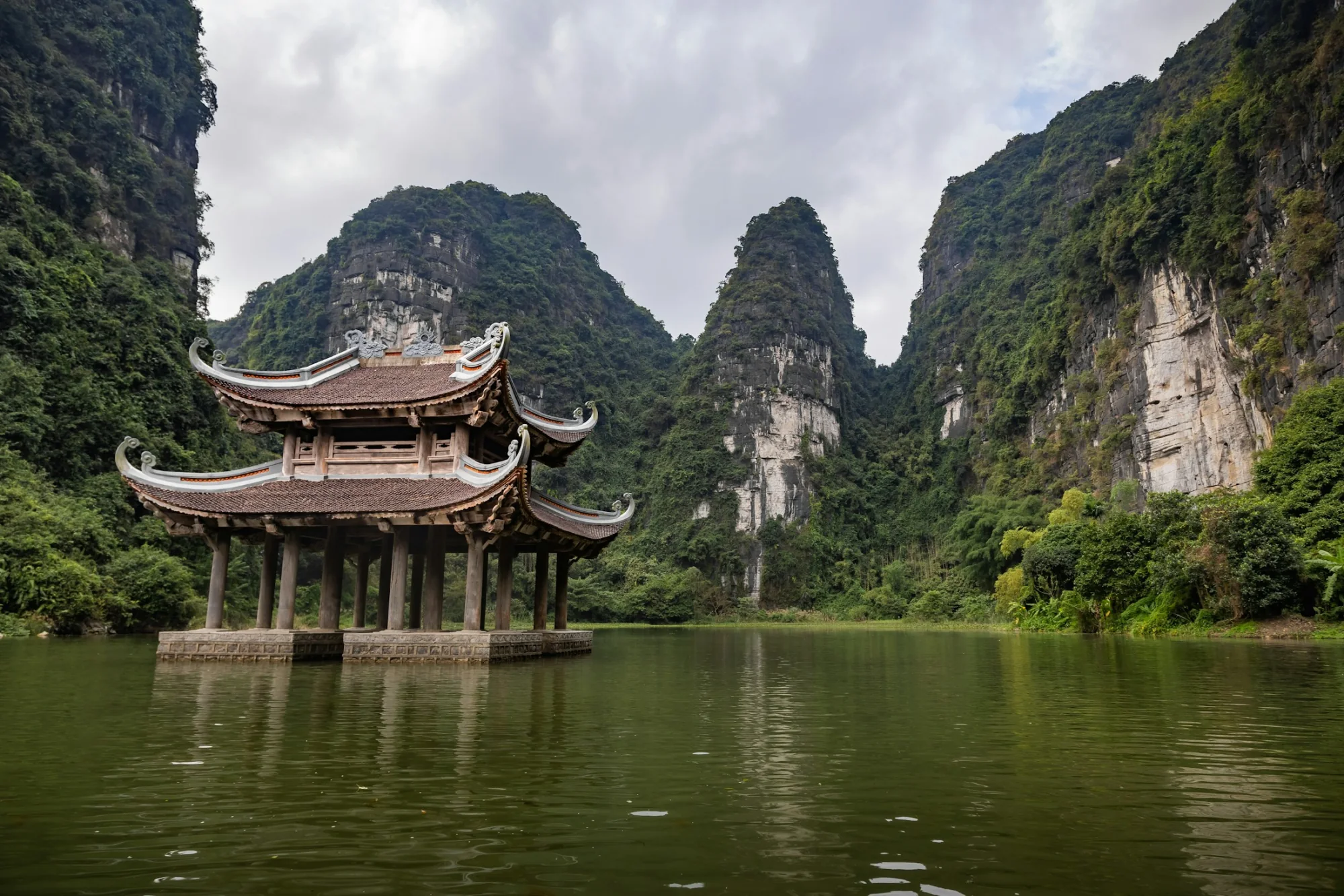 A temple on the water among the karst peaks of Ninh Binh, Vietnam